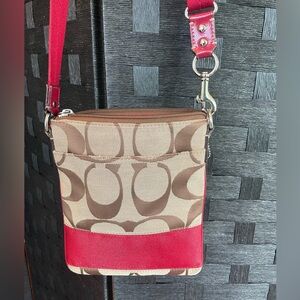 Coach Signature Logo brown and red accent with front and back pocket crossbody.
